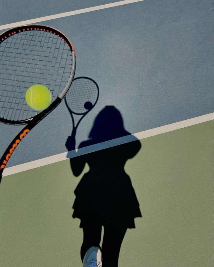 Player shadow serving on a blue and green court